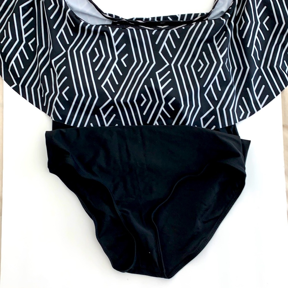 One piece swim suit with shoulder ruffles